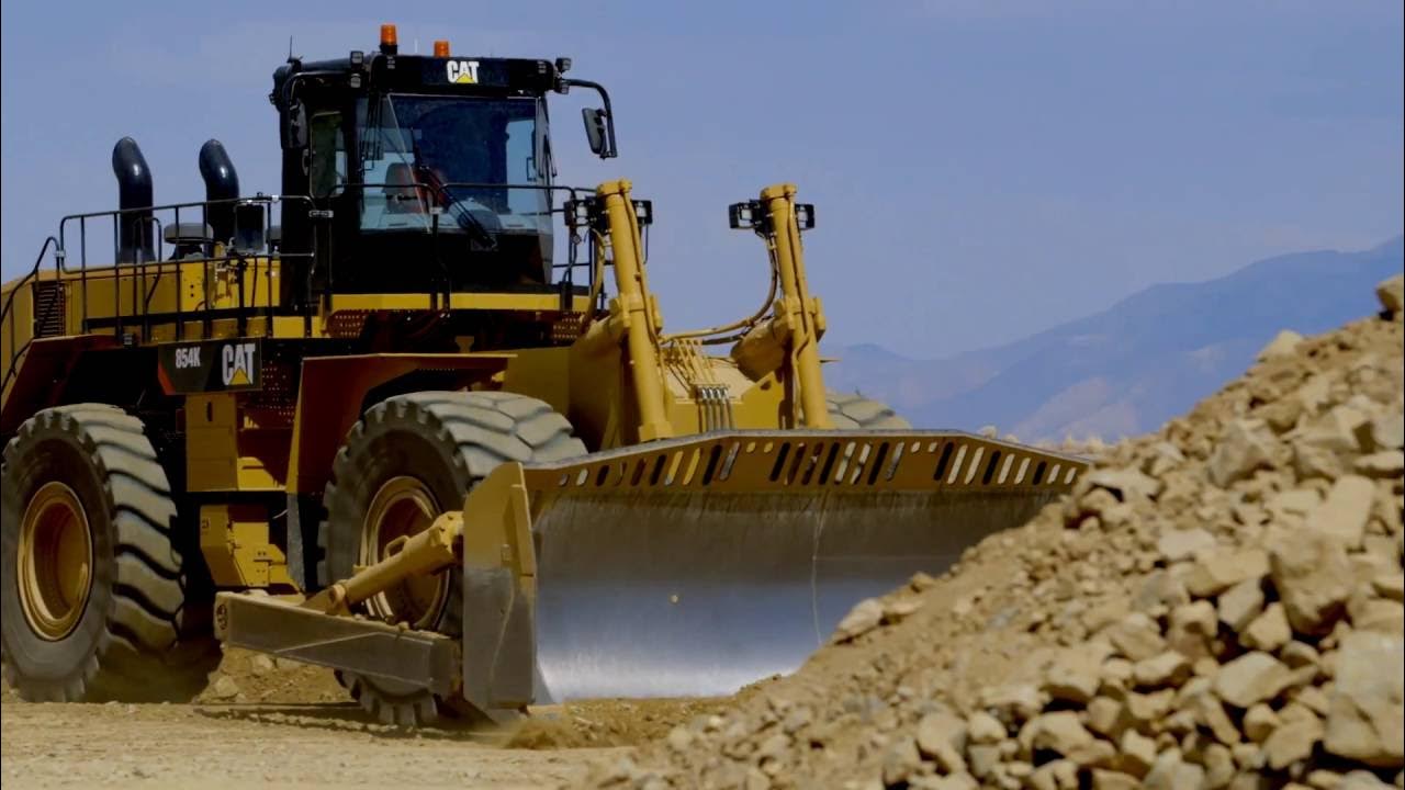 Бульдозер на колесах фото Meet the Pros: Cat ® Wheel Dozers - YouTube