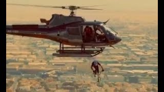 Biker jumps onto skycraper helicopter| CCTV English screenshot 5