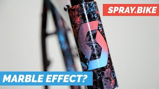 Spraying A Bicycle Frame With A 