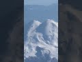 Гора Эльбрус с высоты полёта самолёта. Ясный день.