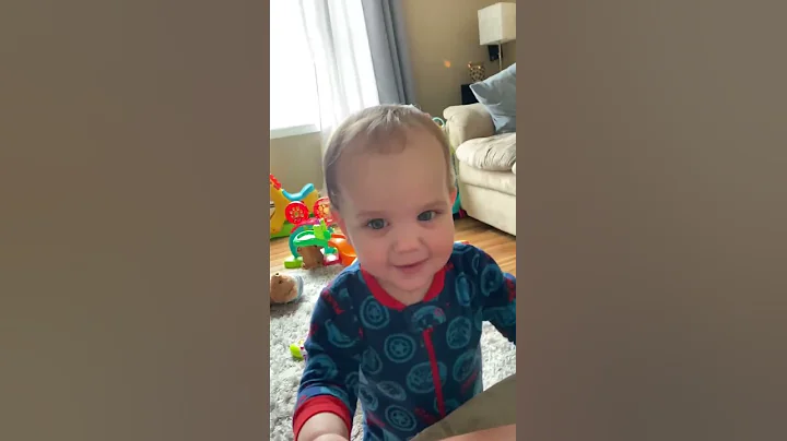 Funny baby goes from happy to serious. Hilarious!