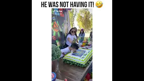 Kid slap in mom face for smash the birthday cake in the face
