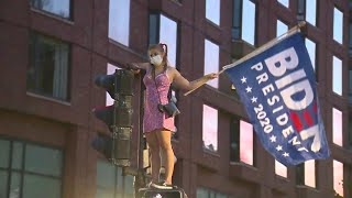 Crowds dance in streets of Boston after Biden's win