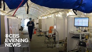 Hospitals overwhelmed as pandemic surges