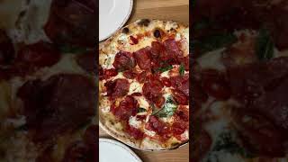 Wood Stack Pizza + Kitchen one bite everybody knows the rules