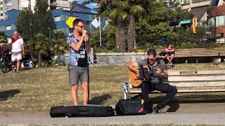 Two Sexy Guys playing and singing on the beach