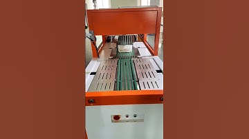 Autoamtic clothing folding and inserting into bag sealing packaging machine