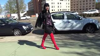 Victoria Devil. Walking in public. Leather jacket, gothic corset, black catsuit and red heeled boots