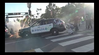 Protest & looting 5/30/20 1 police cruisers race through quiet street
in fairfax neighborhood. 2 protesters clash verbally with during a
tense standof...