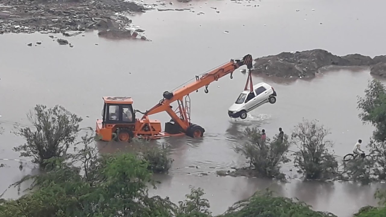 Heavy Rain Crane lifting car YouTube