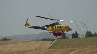 McDermott Aviation Bell 214ST helicopters scooping water for firefighting in Greece 2026