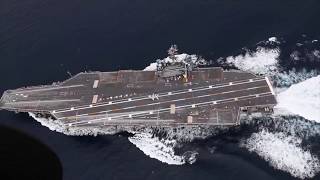 U.S. Navy Aircraft Carrier Performs High Speed Turns