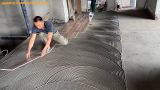 Professional Workers Are Installing Indoor Hallway Flooring Using Wood-Look Ceramic Tiles 80 x 180cm