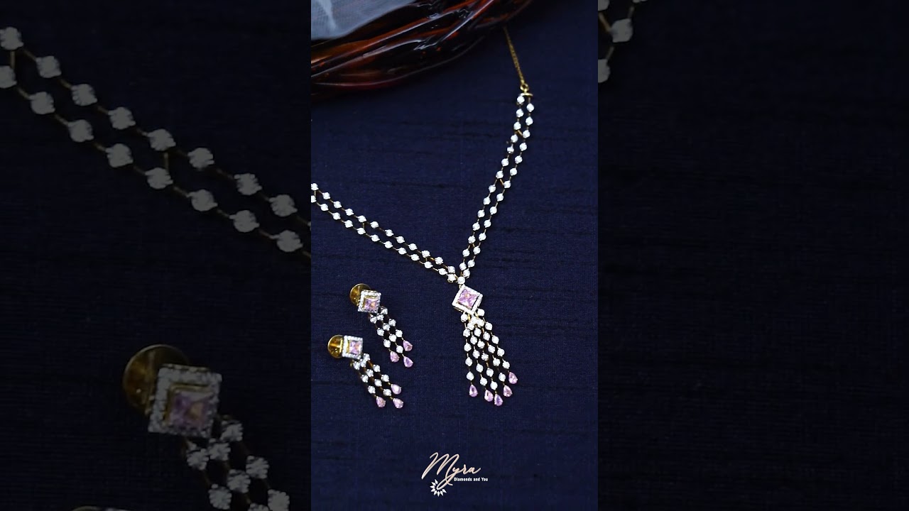 Featuring delicate drizzle diamond set