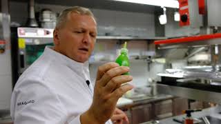Chef Peter Knogl prepares a langoustine dish in 3 Michelin star restaurant Cheval Blanc, Switzerland