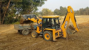 JCB Backhoe Machine Loading Dirt in Tractor - JCB Cutting Mud and Leveling Agro Field