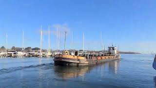 Reversing the dredging barge out of the Yacht Haven