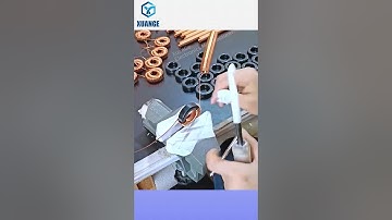 The process of manually winding an inductor coil. Let