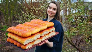 Ukrainian girl cooks pies in a wood-burning oven in the village, countryside aesthetics