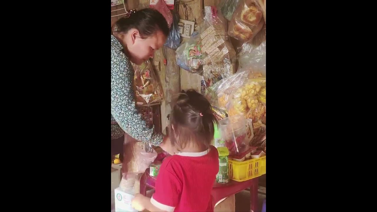 A Single Mother and Her Two Children Gathering Banana Leaves for a Night Shelter