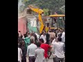 Municipality and Nepal Police removing encroached houses and sheds on Darbar Marg in Butwal