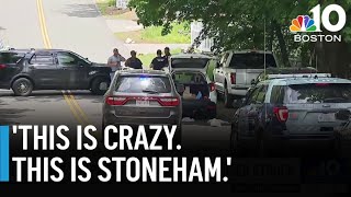 Large manhunt north of Boston after driver hits police car and flees