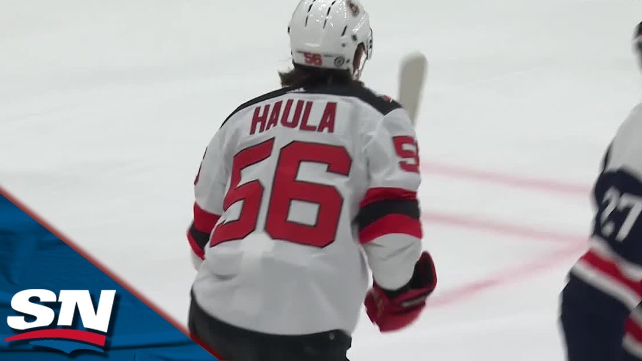 New Jersey Devils' Erik Haula (56) fights for control of the puck