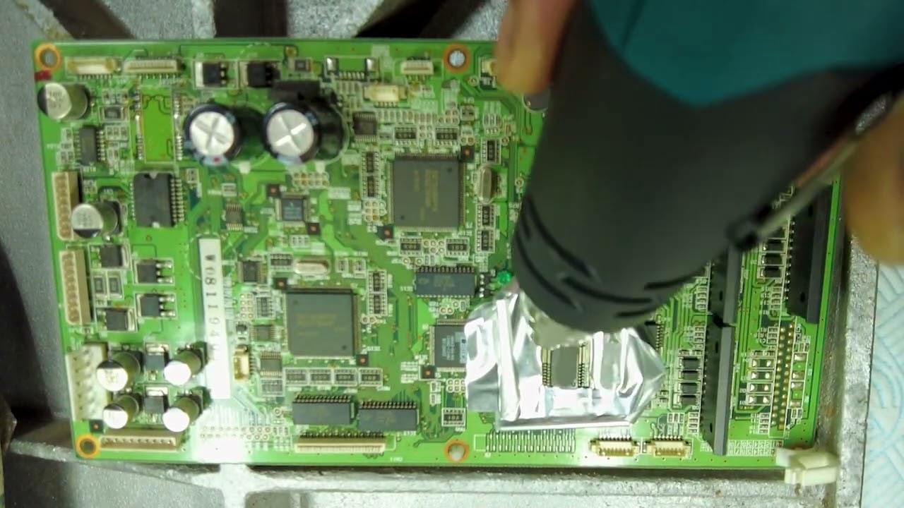Practicing De Soldering an IC from a Servo Board prior to using the chip on an actual board repair