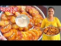 गेहूं के आटे से बना बाहर से कुरकुरा अंदर से सॉफ्ट ओर रसीले मालपुआ। पारंपारिक भारतीय मिठाई।