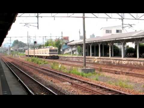 JR San'yo Line and Kure Line passenger trains, and freight trains, at Mukainada Station, near Hiroshima.
