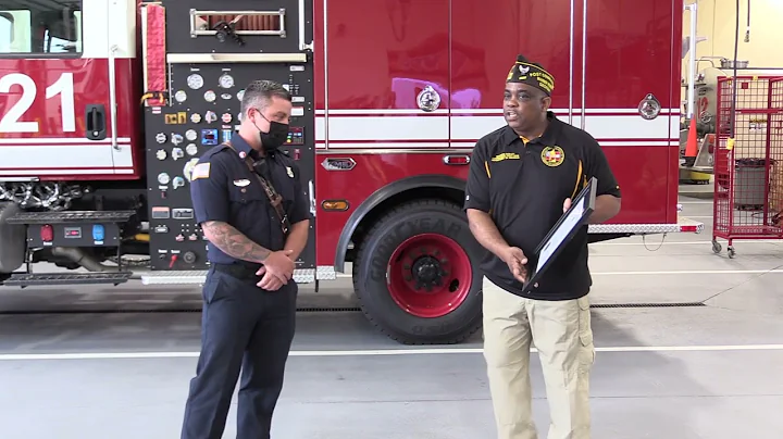 Robins Firefighter wins award rom Maurice Dudley Commander of VFW