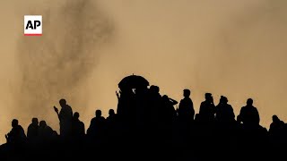 Muslim pilgrims climb Mt. Arafat during Hajj