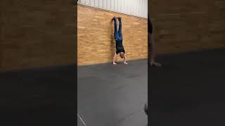 Wall walk to handstand 1/4 turn out