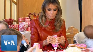 Melania Trump Makes Hearts With Children at Hospital