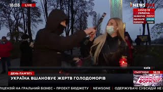 Ukrainian attacks memorial airing for Soviet-era famine victims. Calls them fascists, smashes mic