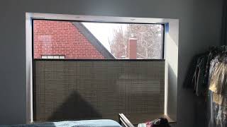 Bottom-up Lutron tensioned motorized shade.