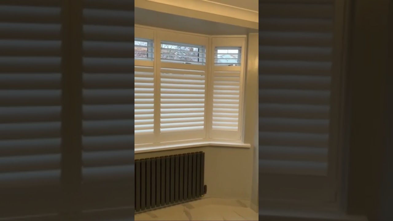 Pure White Shutters In Bay Window