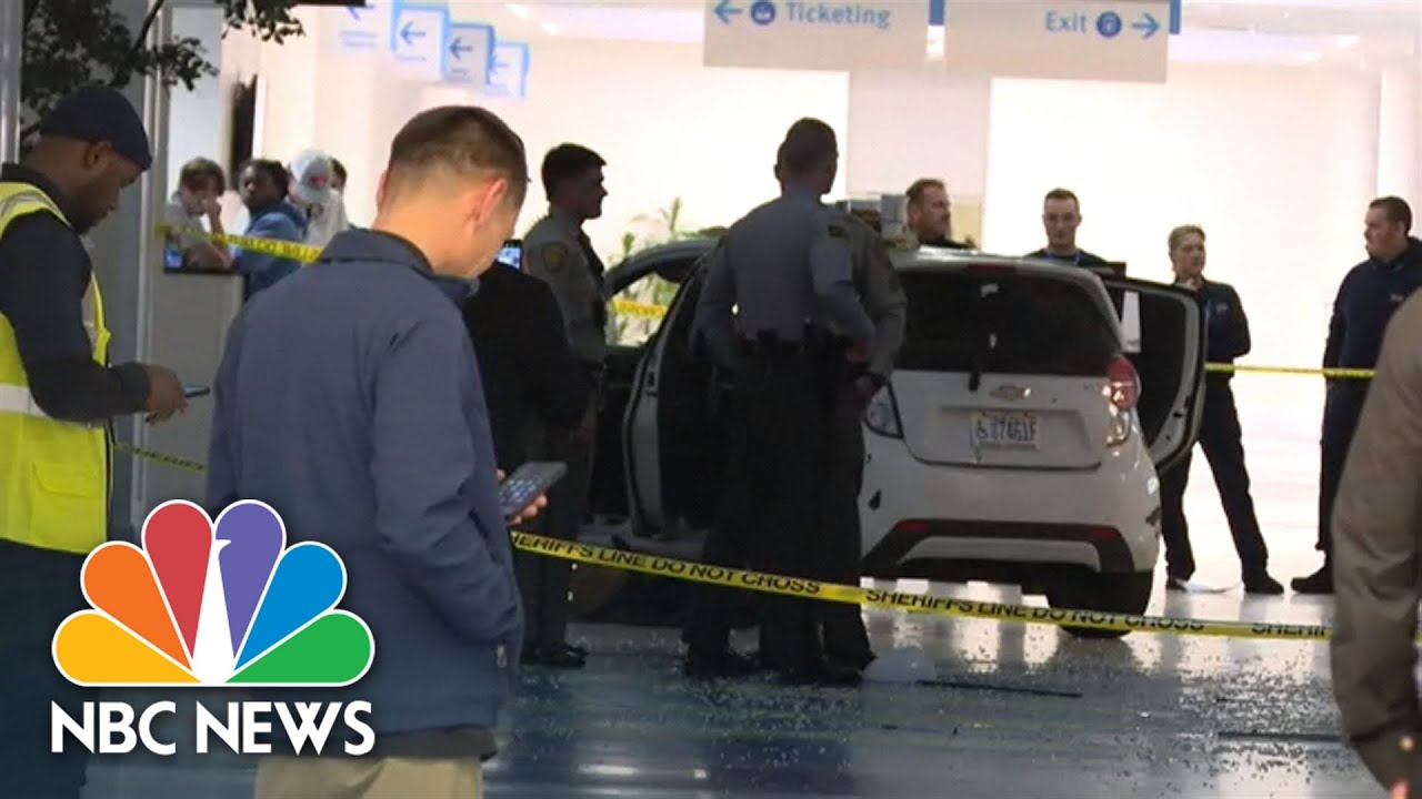 Suspect in custody after car ends up inside airport terminal building