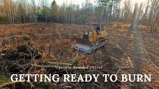 Building a massive brush pile to burn