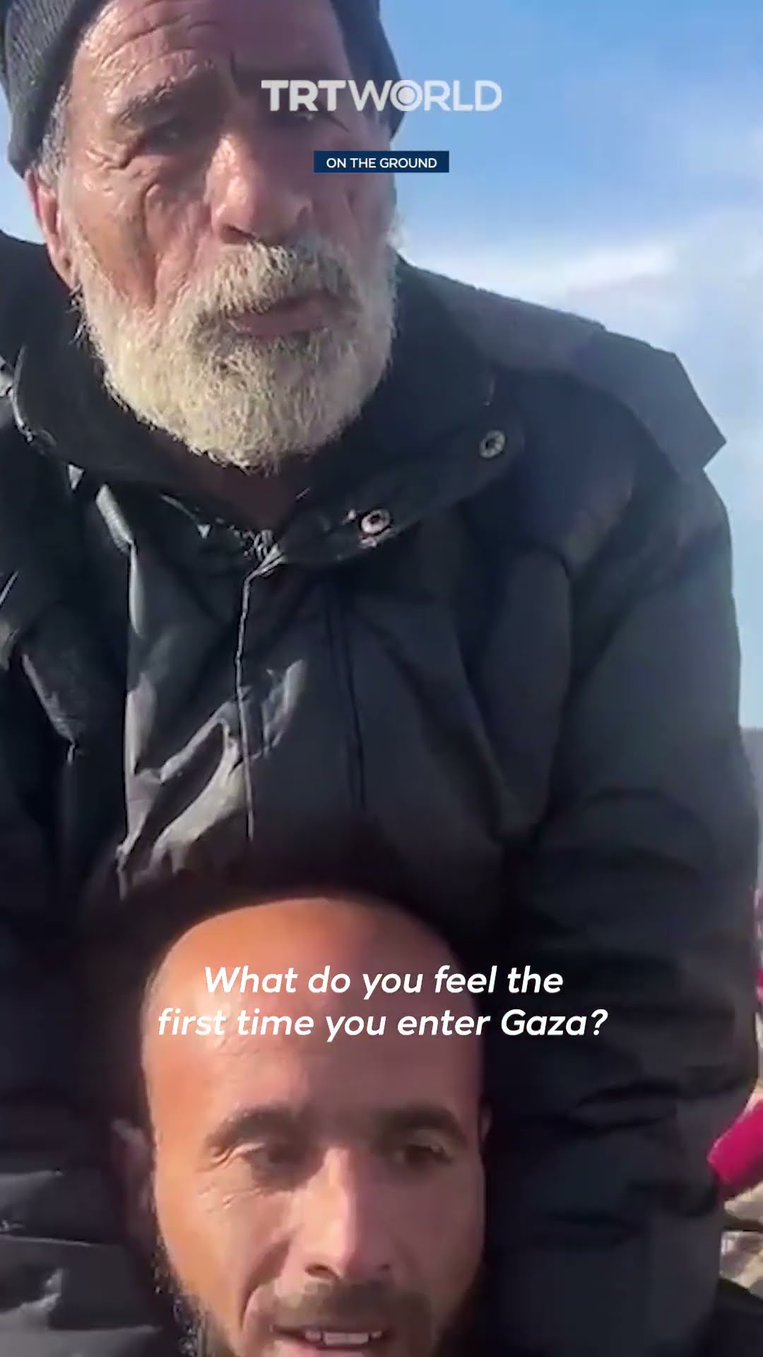 Palestinian man carries his elderly father as they return to Gaza city