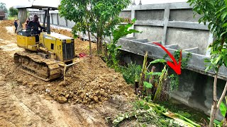 Small Bulldozer Working Filling Down The Wall With 5T&25T Dump Truck Loading Soil