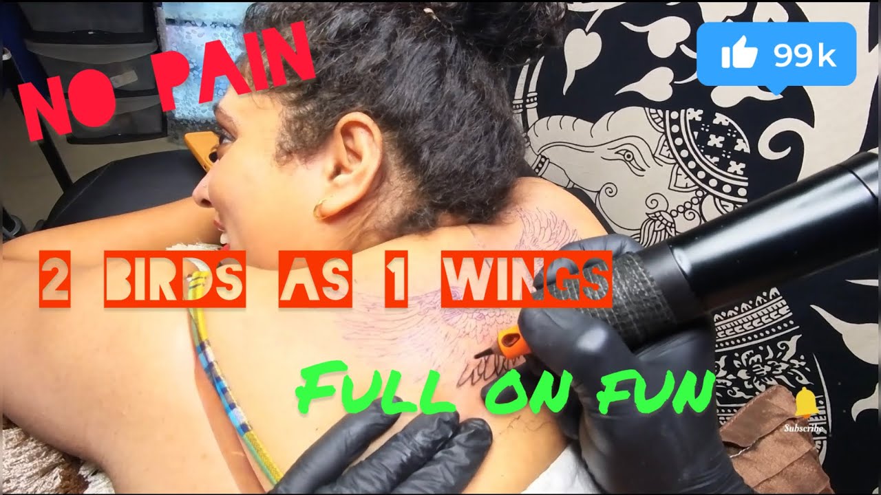 tattoo graces her neck,covering dark skin—symbol of strength,freedom, and a beautiful rebirth