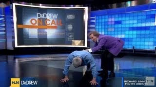 Richard Simmons making Dr. Drew do push-ups?