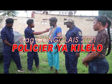 Gag POLICIER YA KILELO Avec Maviokele Vue De Loin Decor Coupure