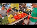 Selling Fresh Vegetables At The Farmers Market