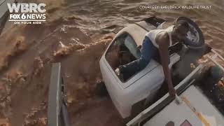 The daring rescue of a truck driver caught on video after he gets caught in a flood in Kenya.