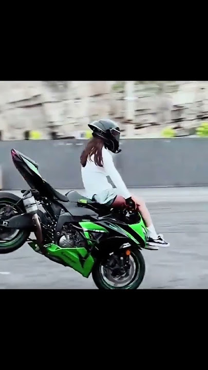 BEAUTIFUL GIRL IS GOOD AT FREESTYLE ON A BIG BIKE