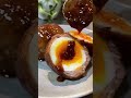 Soft-boiled egg rolled with meat