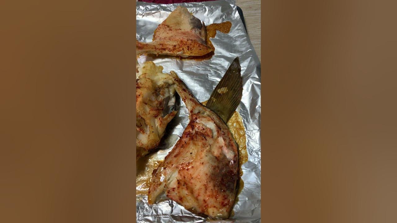 Baked halibut collar with lemon, pepper and salt Baked fish short