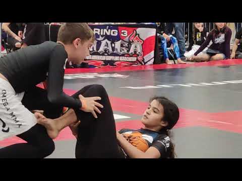 Jiu-Jitsu finals!  grey belt girl chokes orange belt boy, wins by points!